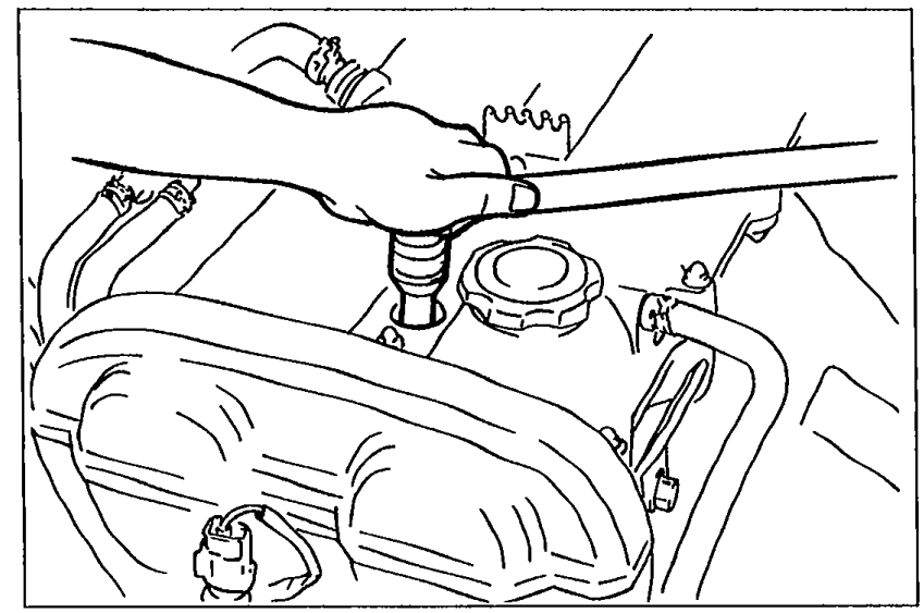 Spark plug being installed into the cylinder head with antiseize compound or molybdenum-based lubricant on threads.