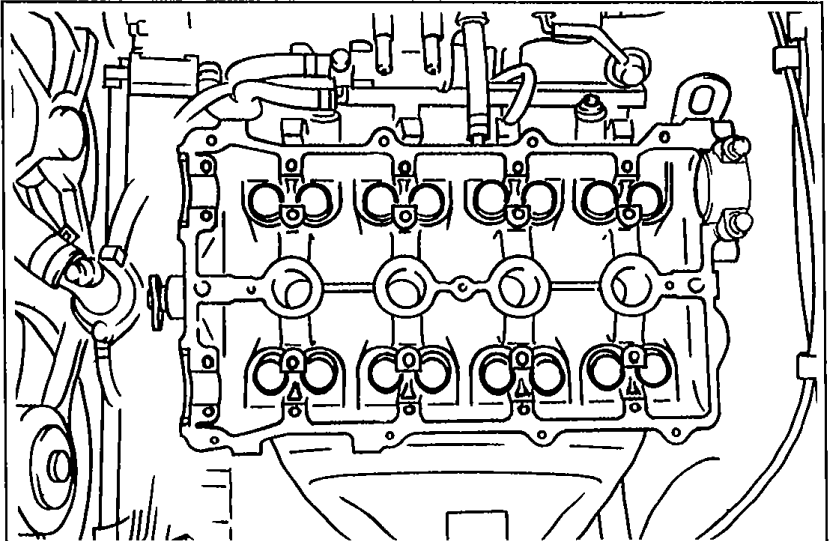 Top view of cylinder head with camshafts removed, showing HLA buckets in their bores.