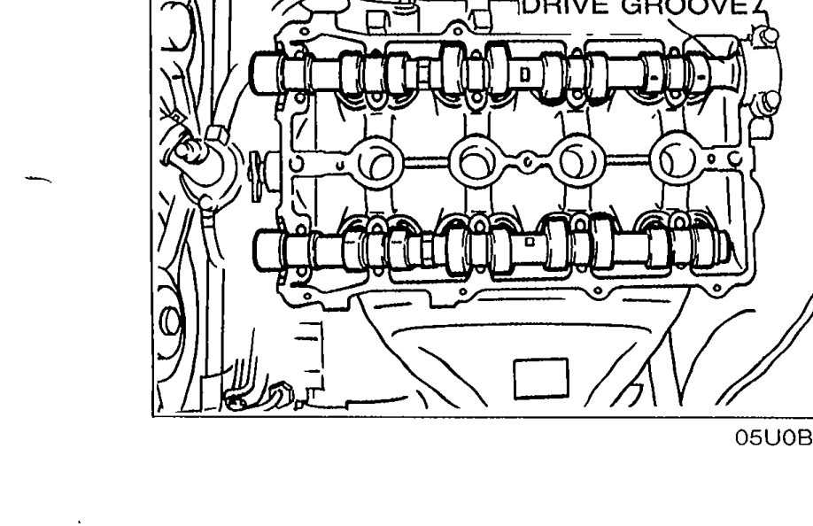 Top view of cylinder head with camshafts in place, with arrow callout to the CRANK ANGLE SENSOR DRIVE GROOVE on the intake camshaft.