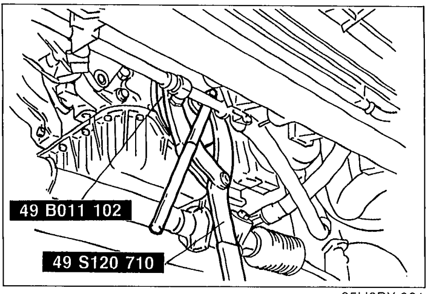 Illustration of SSTs in use on the crankshaft/timing belt pulley to hold it while loosening the pulley lock bolt. Tools labeled 49 B011 102 and 49 S120 710.