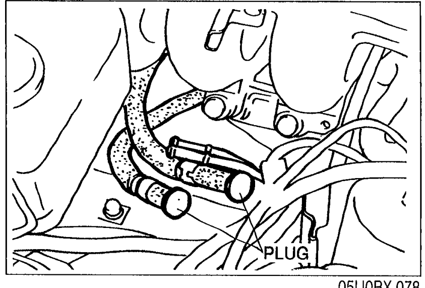 Fuel hoses disconnected with plugs installed to prevent leakage. Label PLUG indicates a plug fitted to a hose end.