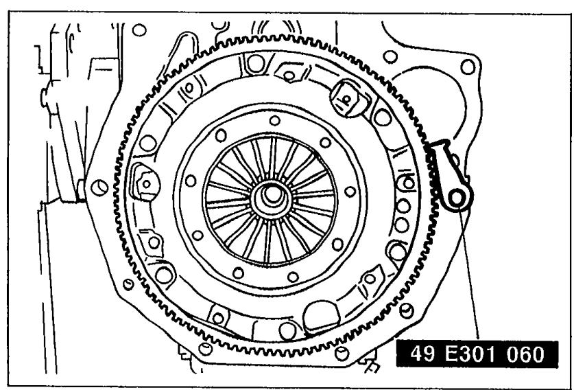 Flywheel/ring gear with SST 49 E301 060 ring gear brake installed to hold the flywheel during crankshaft pulley removal.