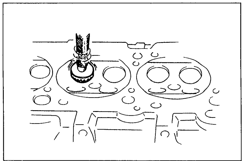 Resurfacing a valve seat with a 45° valve seat cutter inserted into the combustion chamber from above the cylinder head.