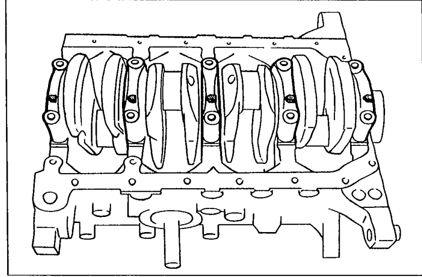 Crankshaft installed in the cylinder block with main bearing caps in place, viewed from above showing all journals.