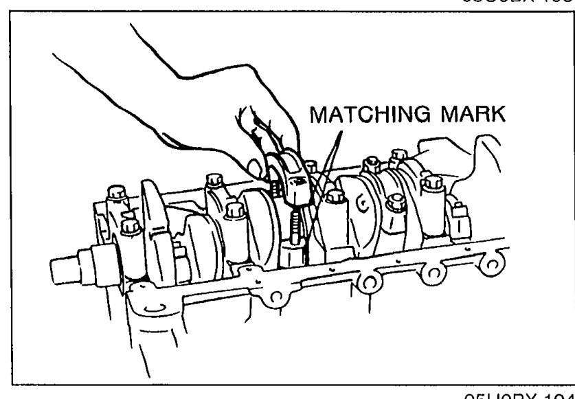 Connecting rod cap being installed on the crankshaft journal, with a 'MATCHING MARK' callout pointing at the alignment mark on the rod and cap.