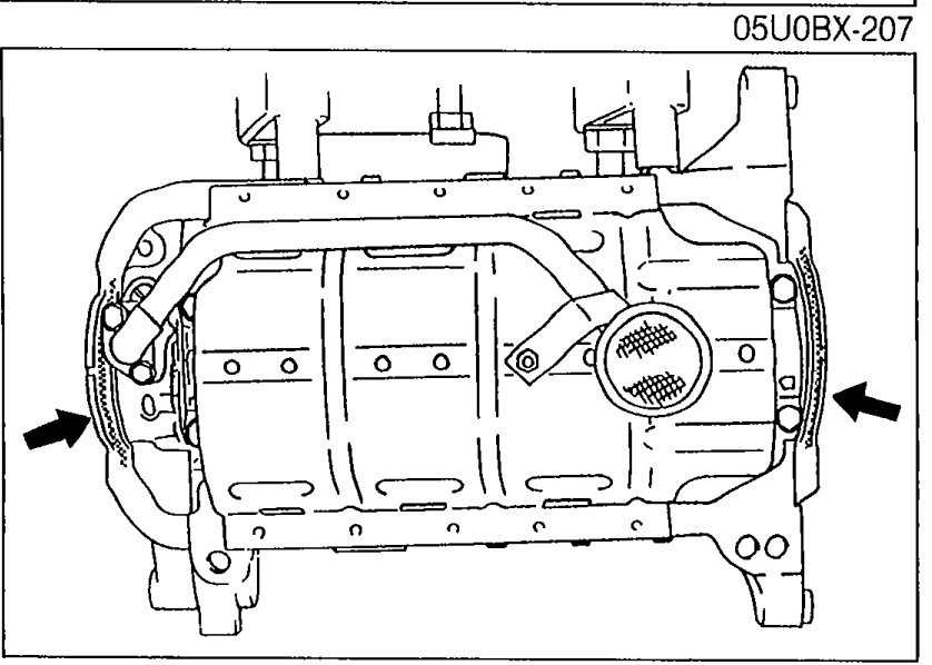 Oil pan viewed from below with arrows pointing to shaded areas where silicone sealant is to be applied to the mating surface.