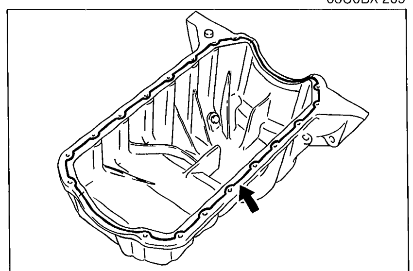 Oil pan interior view with an arrow indicating where the continuous bead of silicone sealant is applied along the inside of the bolt holes.
