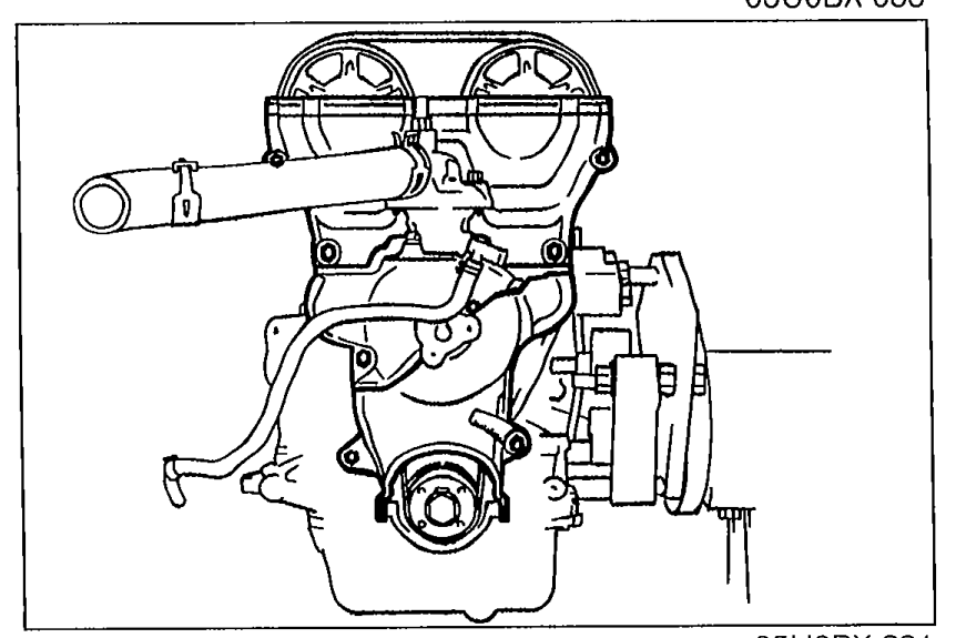 Lower, middle, and upper timing belt covers installed on the engine.