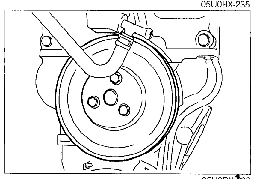 Water pump pulley installed on the front of the engine.