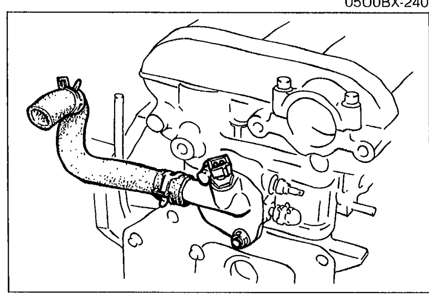 Water outlet pipe installed on the cylinder head with mounting flange visible.