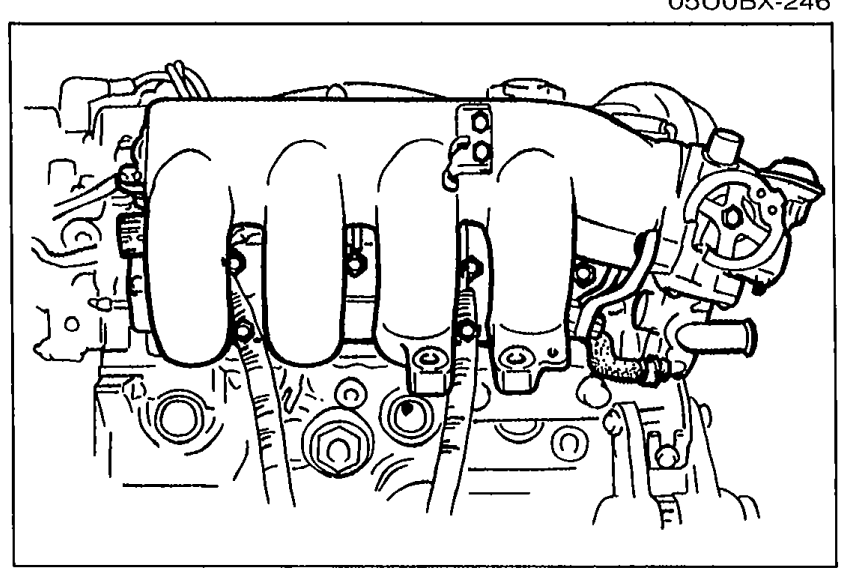 Intake manifold assembly installed on the cylinder head showing the four intake runners.