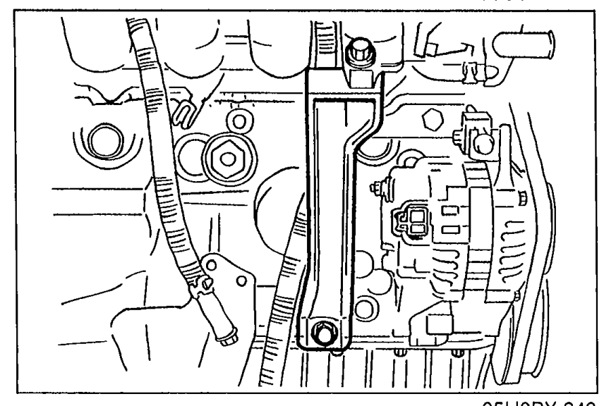Manifold bracket installed on the engine block, side view.