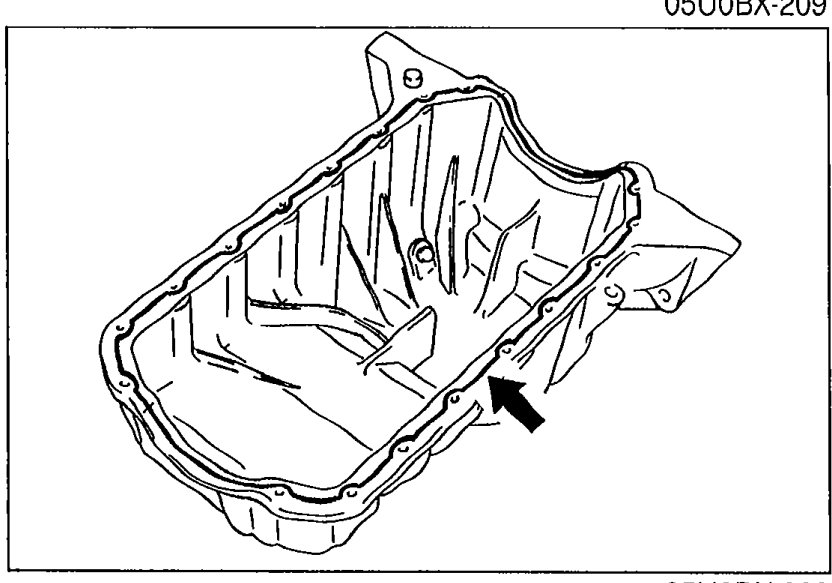 Underside view of the oil pan showing the bolt-hole flange with an arrow indicating where to apply a continuous bead of silicone sealant inside the bolt holes.