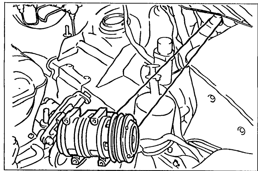 Photograph of the A/C compressor (with belt visible) being removed from the engine bay with hoses still connected.