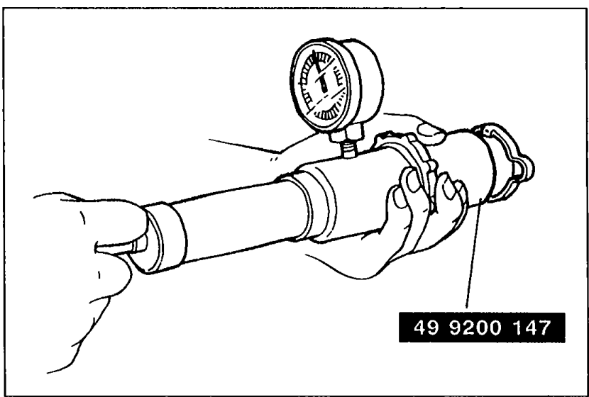 Photo of SST 49 9200 147 (Adapter B) attached to a radiator cap with a pressure gauge for radiator cap valve testing.