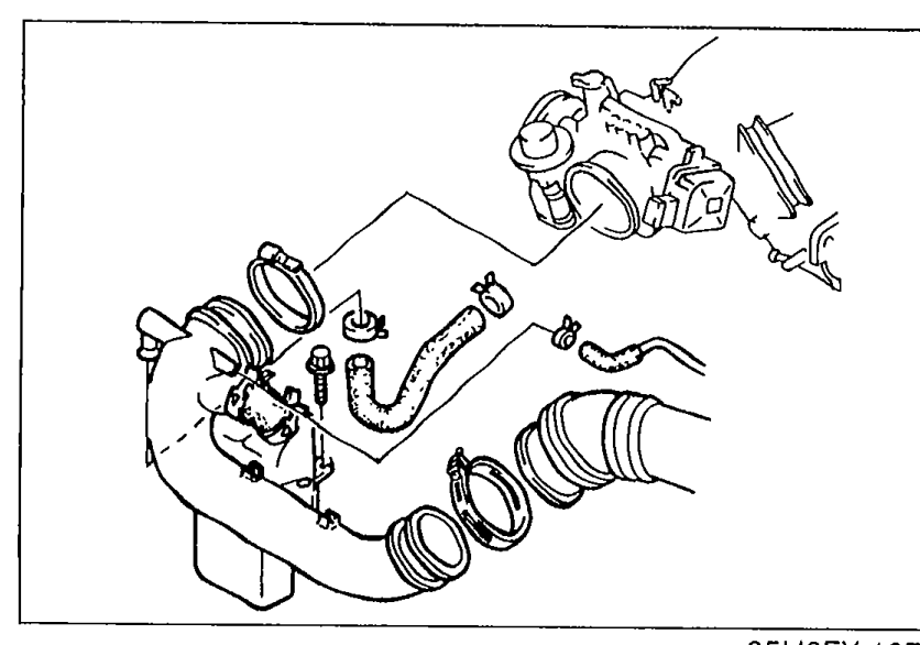 Photo of the engine bay showing the air pipe attached to the throttle body. Illustrates removal of the air pipe.
