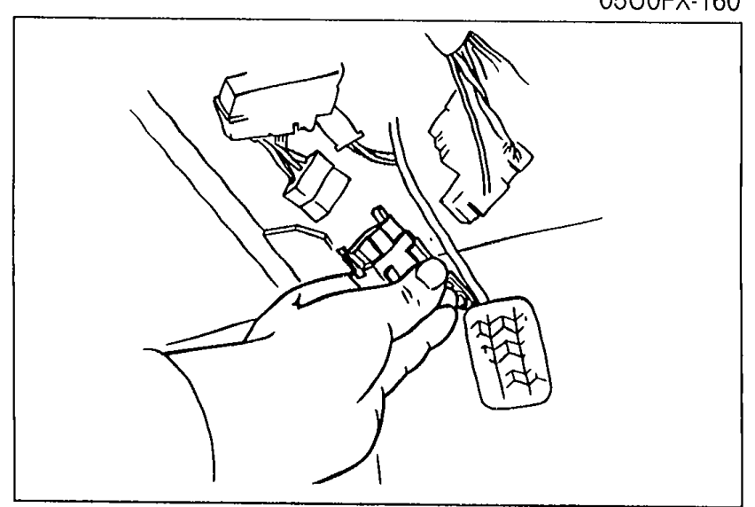 Photo of the circuit opening relay being removed from its mounting location with the wiring connector attached.