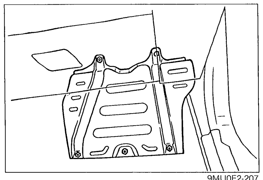 Photo of vehicle interior floor area showing the protector cover under the passenger seat floormat, lifted/removed to access the ECU area.