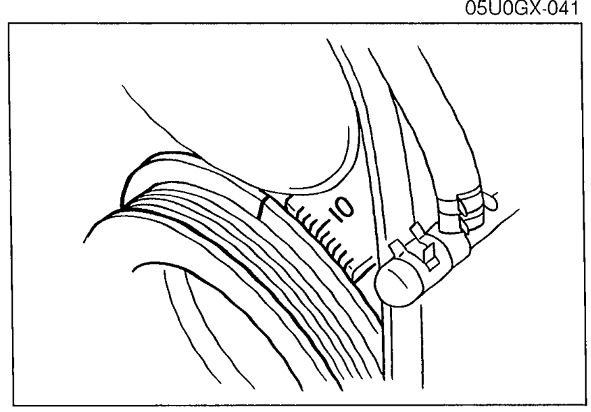 Close-up of the crank angle sensor area showing the lock bolt for ignition timing adjustment.