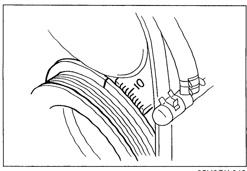 Close-up of crankshaft pulley timing-mark area with the timing belt cover scale (continuation from previous page — verifying ignition timing advances).