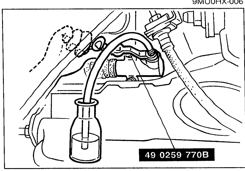 Illustration of the SST flare-nut wrench (49 0259 770B) on the clutch release cylinder bleeder screw, with vinyl hose attached and drained into a container.