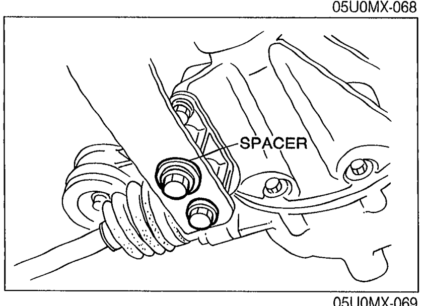 Photo of the differential-side end of the PPF showing the bolts and the SPACER label between the PPF and differential mounting boss.