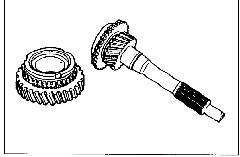 Photograph of the main drive gear assembly showing the gear teeth, synchronizer cone, and splined input shaft.