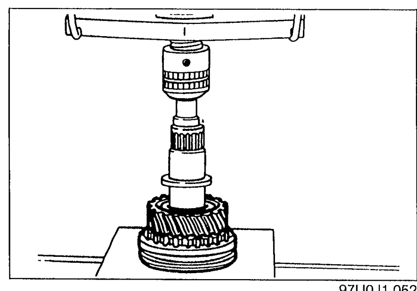 Pressing the mainshaft into the 2nd gear and 1st/2nd clutch hub assembly seated on a press fixture.