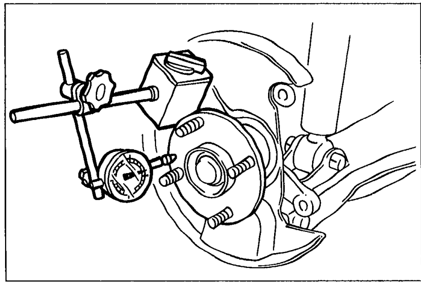 Photograph of the rear wheel hub with a dial indicator positioned against the hub to measure wheel bearing play in the axial direction.