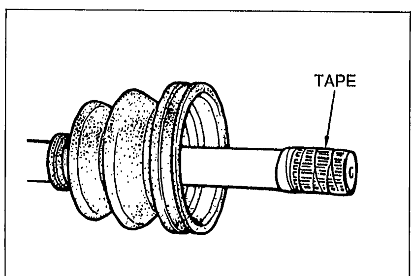 Driveshaft with TAPE wrapped around the shaft splines and the boot being removed from the shaft.