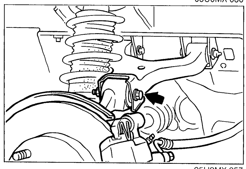 Under-vehicle view of the upper arm and suspension showing the installation bolt/nut location to be removed.