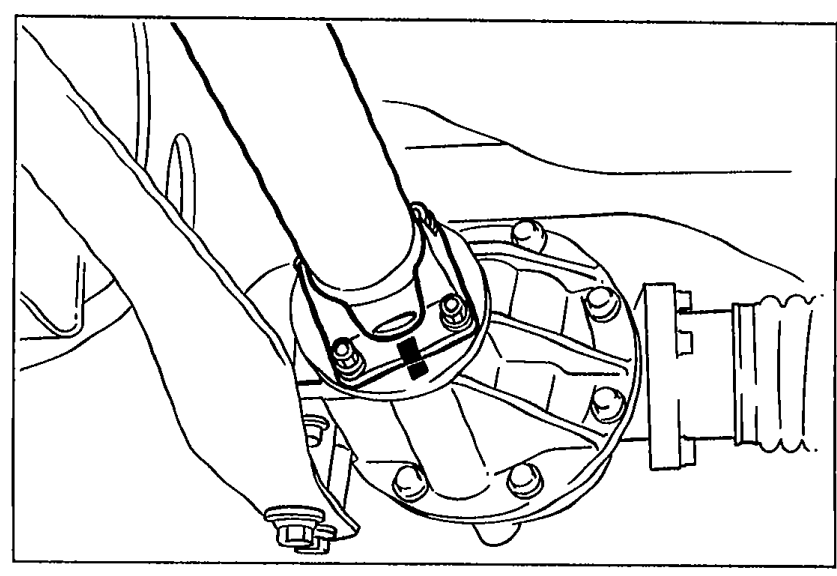 Close-up of the propeller shaft and differential extension housing flange before removal; alignment marks should be made on both flanges for correct reinstallation.