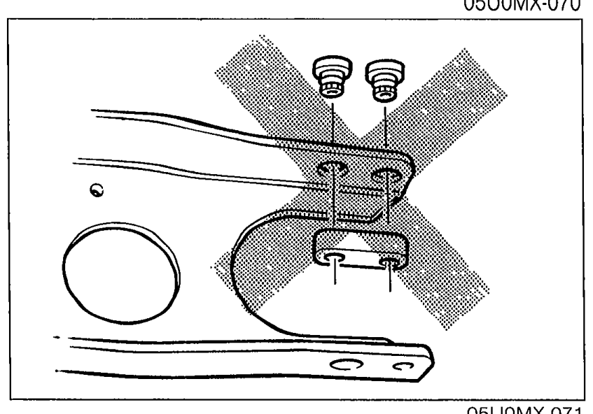 Photograph of the transmission-side PPF spacer area with two large X marks overlaid on the spacers indicating that these spacers must not be removed.