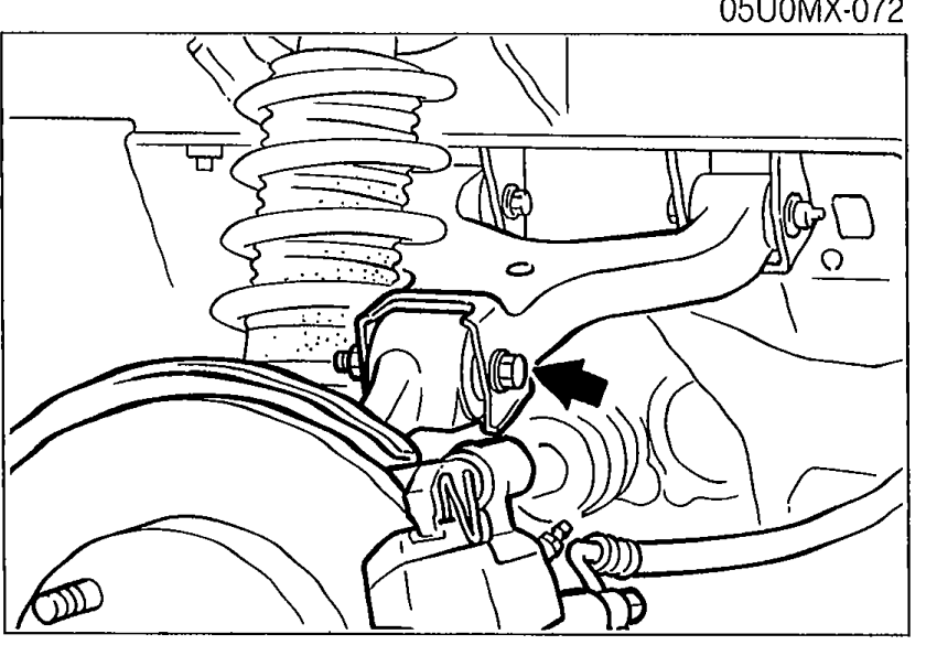 Photograph showing the differential supported by a jack from below with arrow indicating the forward direction in which to move the differential.