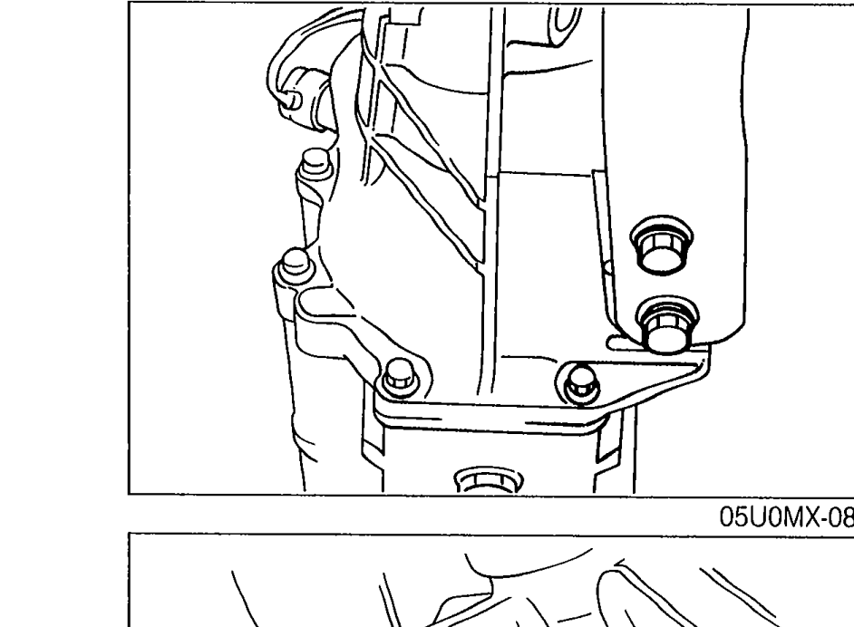 Photograph of the transmission area showing the transmission-side bolts being tightened on the power plant frame bracket.