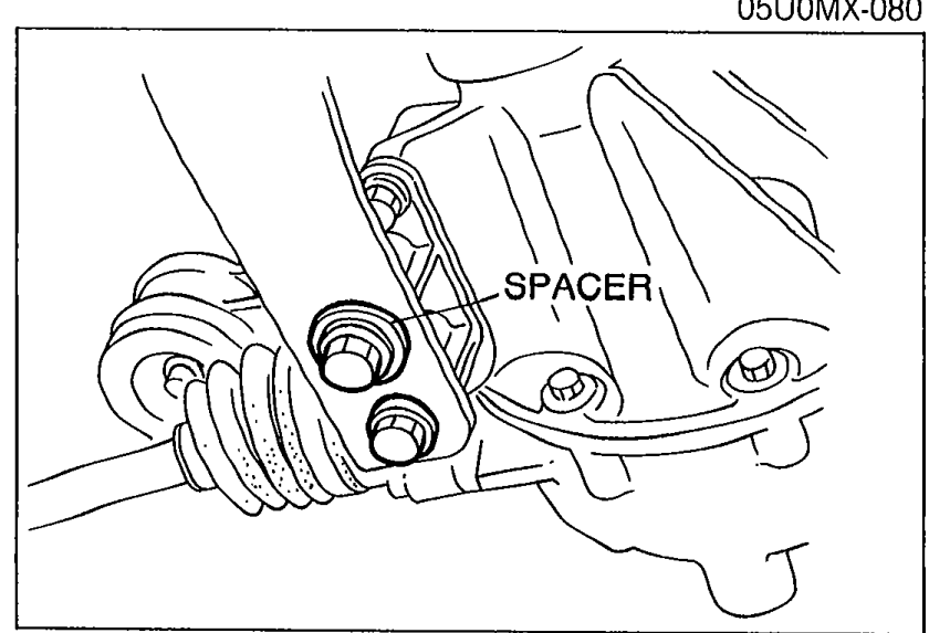 Photograph of the differential-side area with callout labelling 'SPACER', showing the bolts to be tightened.