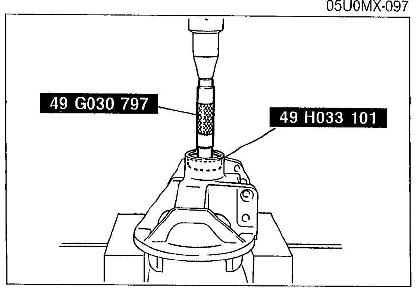 Illustration showing SST 49 G030 797 and SST 49 H033 101 being used to install the bearing outer race (front bearing) into the differential carrier.