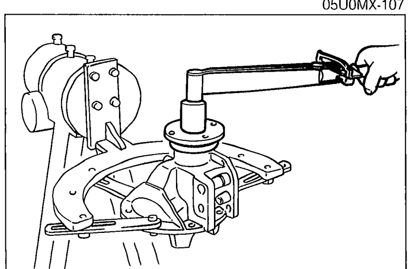 Photo showing a torque wrench being used to measure the drive pinion preload on the differential carrier.