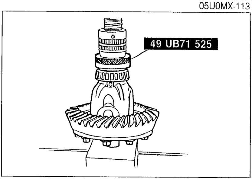 Photo showing SST 49 UB71 525 being used to press the bearing inner races (side bearing) onto the differential case.