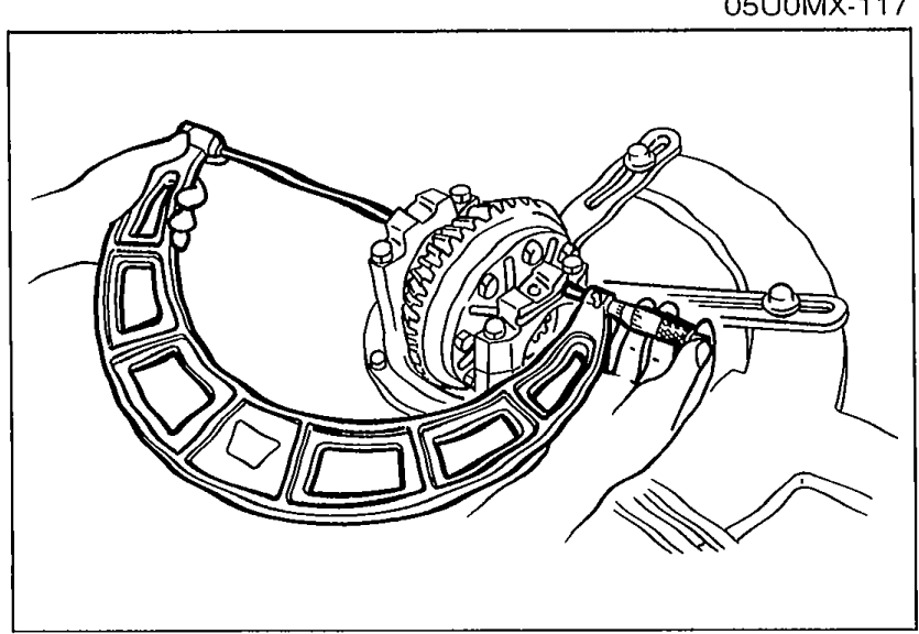 Illustration showing the bearing caps installed on the differential carrier with the adjusting nuts being tightened to set the distance between the pilot sections.