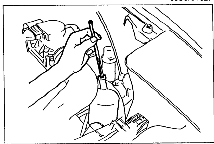 Hands holding the steering wheel, demonstrating turning the wheel fully left and right to raise fluid temperature.
