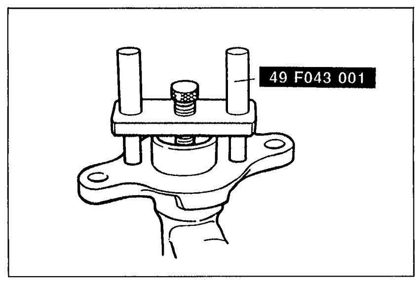 SST 49 F043 001 (push rod clearance gauge) placed atop the master cylinder for measuring push rod-to-piston clearance.
