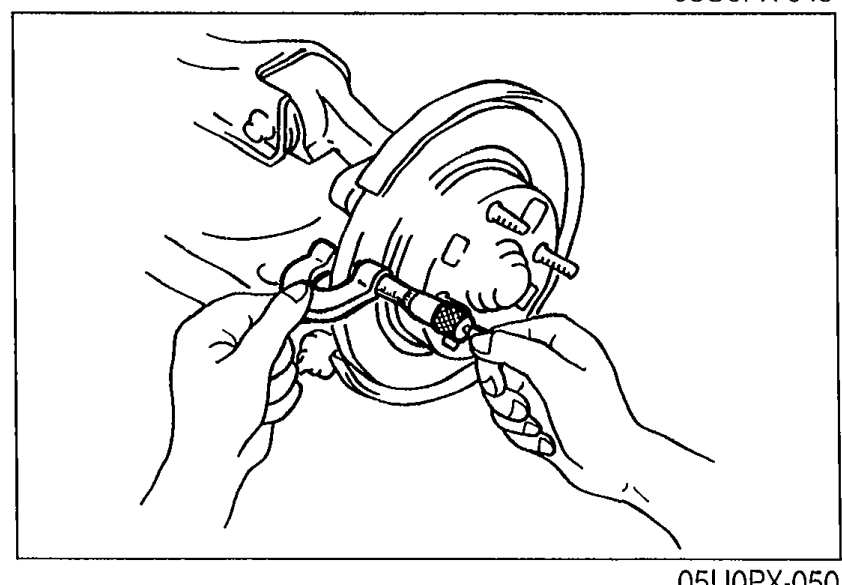 Illustration of measuring rear disc plate thickness with a micrometer at the outer edge of the rotor surface.
