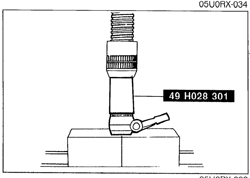 SST 49 H028 301 (Installer, dust boot) pressing a new dust boot onto the ball joint stud.