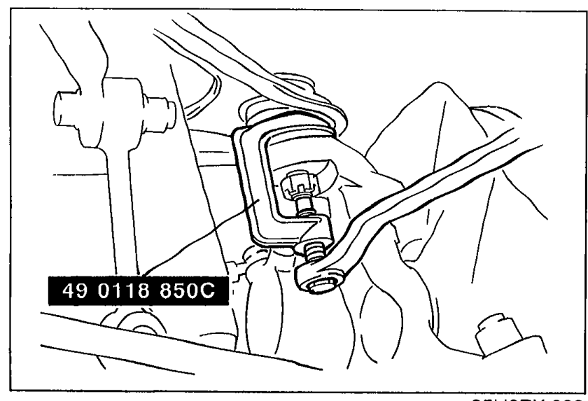 SST 49 0118 850C (Puller, ball joint) installed to separate the upper arm ball joint from the knuckle.