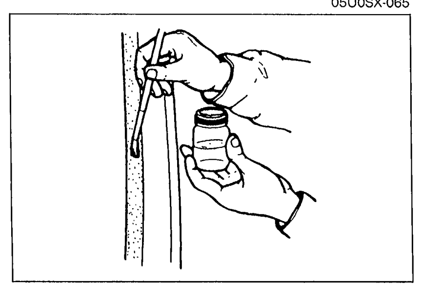 A hand applying primer with a brush from a small bottle along the bonding area of the body pinch weld. Illustrates installation step 3.