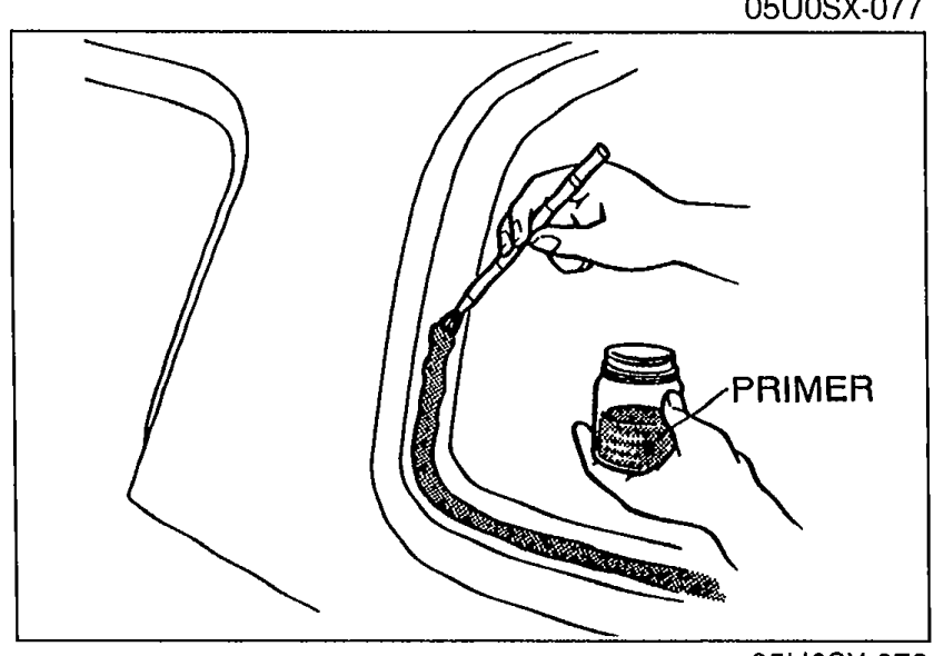 A hand applying PRIMER from a small bottle with a brush along the bonding area of the hard-top rear-window aperture. Illustrates installation step 3.