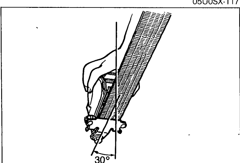 Illustration showing retractor held inclined at approximately 30 degrees while pulling the belt out, to test the locking mechanism.