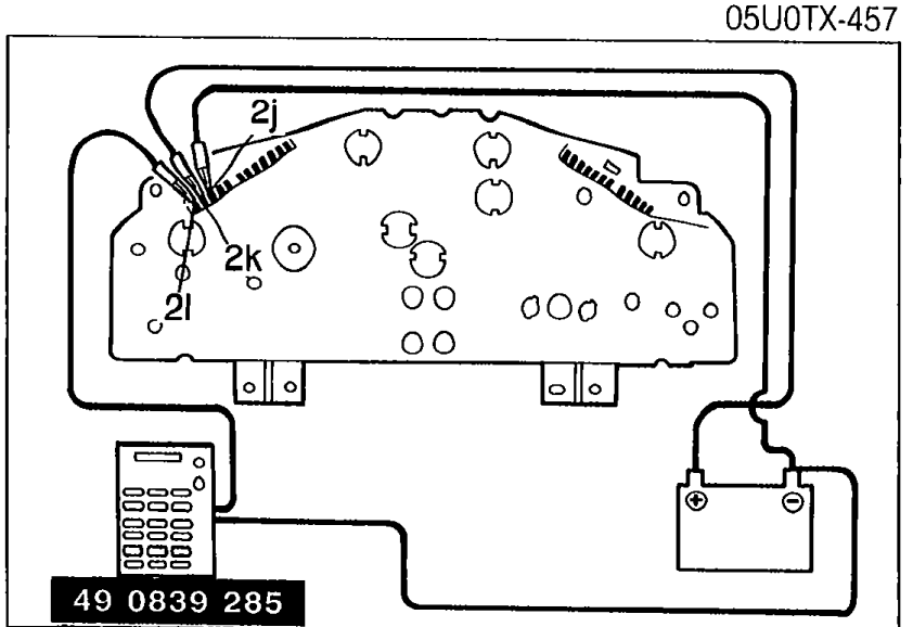 Instrument cluster rear view showing connection of SST 49 0839 285 to terminals 2l and 2k with red and black leads, with 12V power and ground connections.