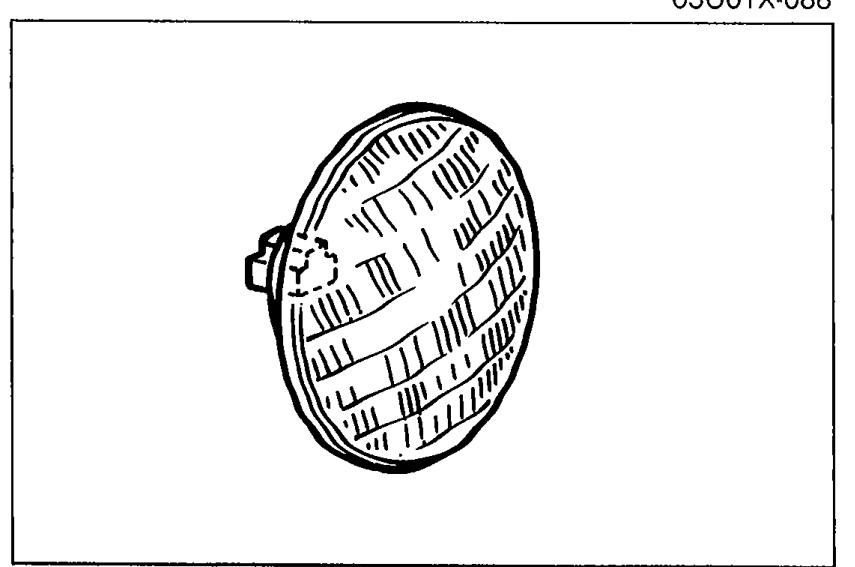 Photo of a sealed-beam headlight unit illustrating Step 4 (Check the headlight bulbs).